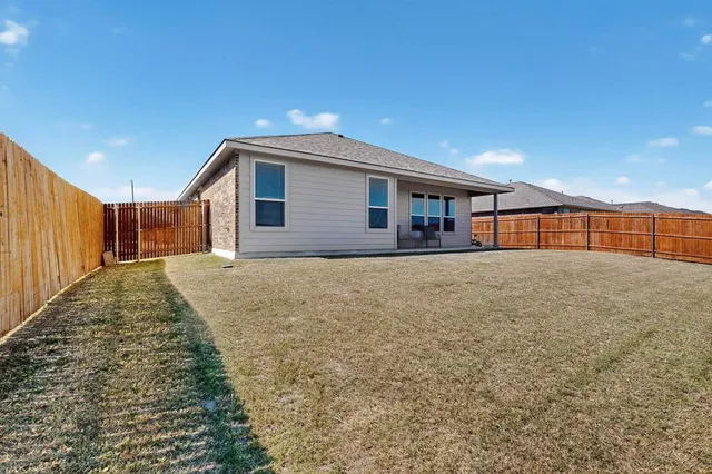 a view of backyard of house