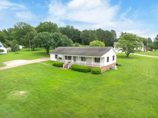 a view of a house with a big yard