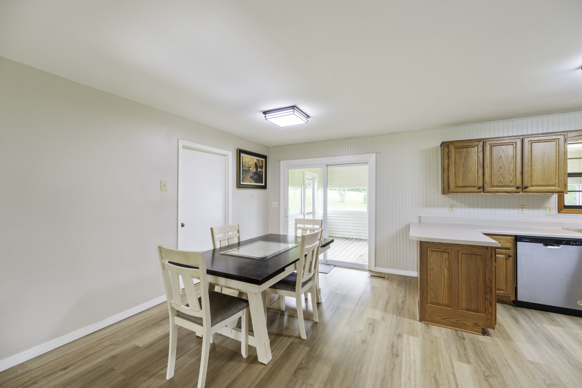 17930 West Main Street Huntingdon, TN 38344 - Photo 11 of 28 a dining room with wooden floor and stainless steel appliances
