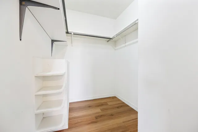 a view of an empty walk in closet
