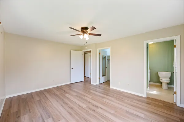 a view of an empty room and wooden floor