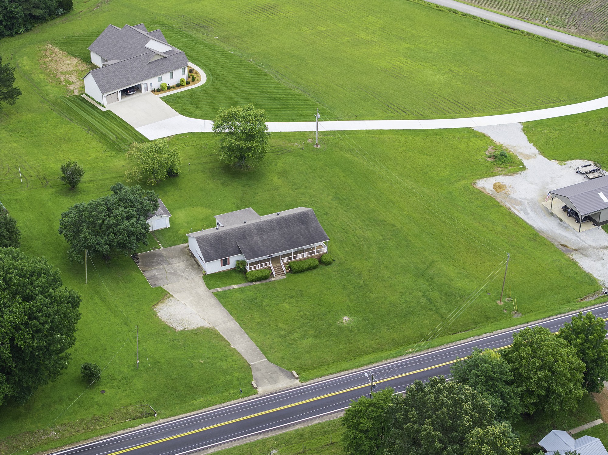 17930 West Main Street Huntingdon, TN 38344 - Photo 26 of 28 a view of a big yard with potted plants and large tree