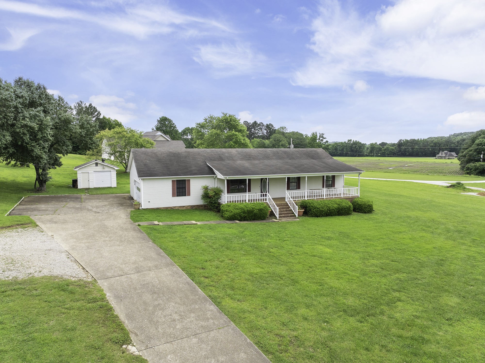 17930 West Main Street Huntingdon, TN 38344 - Photo 28 of 28 a front view of a house with garden