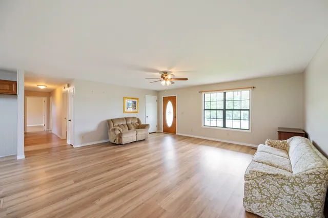 a view of a livingroom with furniture and wooden floor