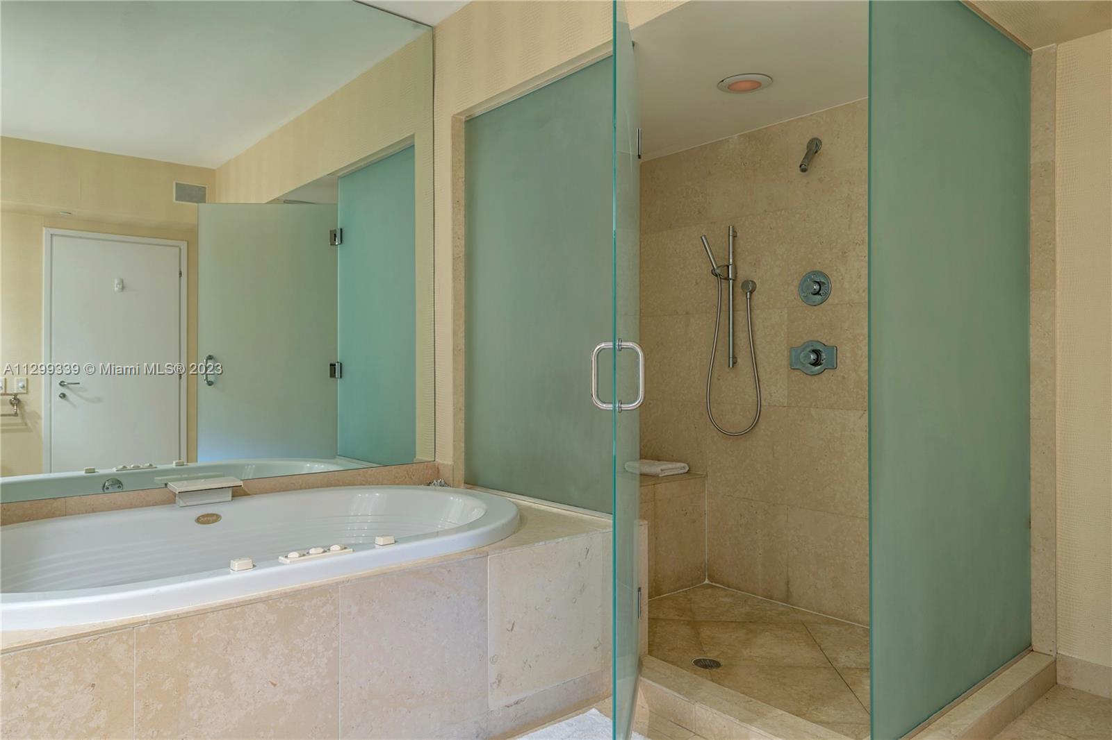 450 Alton Road, Unit 3603 Miami Beach, FL 33139 - Photo 15 of 25 a bathroom with a bathtub and shower