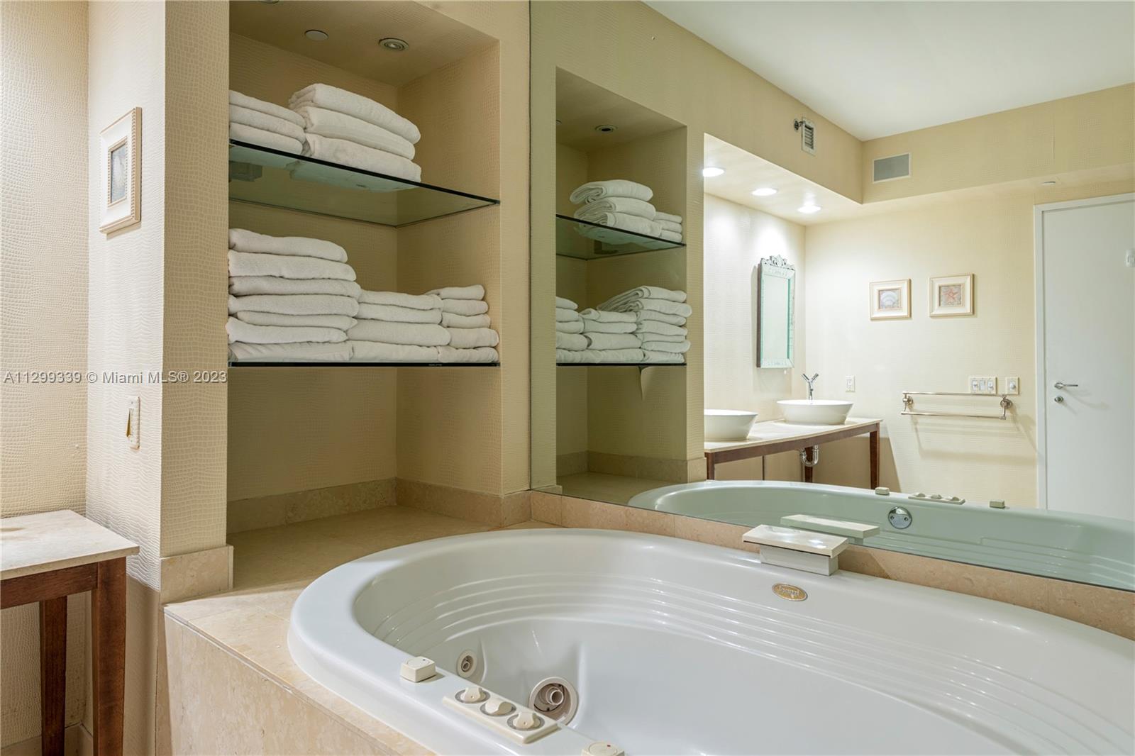 450 Alton Road, Unit 3603 Miami Beach, FL 33139 - Photo 16 of 25 a bathroom with a tub and a shower