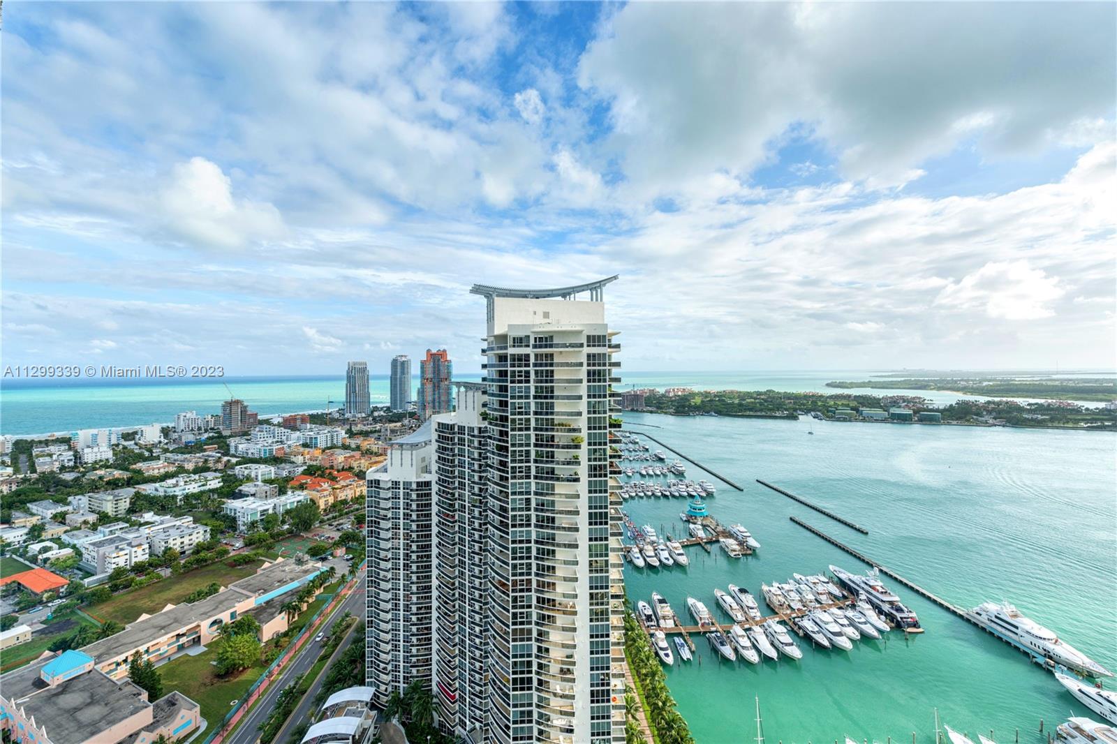 450 Alton Road, Unit 3603 Miami Beach, FL 33139 - Photo 8 of 25 a view of a city and a lake