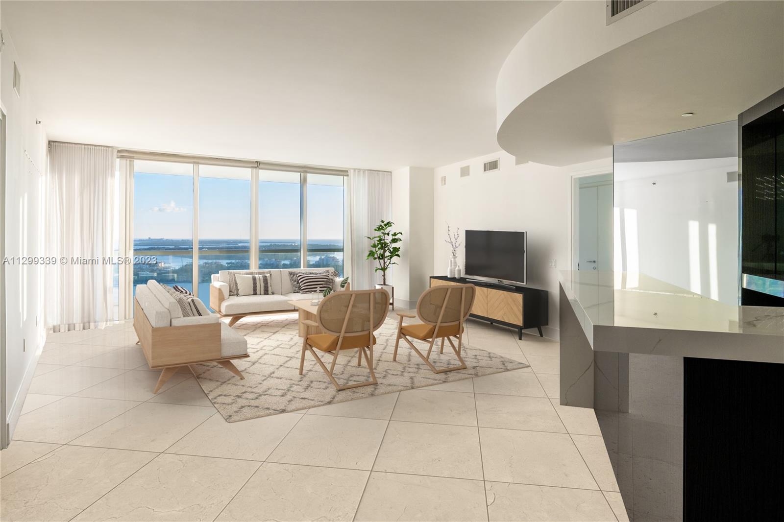450 Alton Road, Unit 3603 Miami Beach, FL 33139 - Photo 9 of 25 a living room with furniture a large window and a flat screen tv