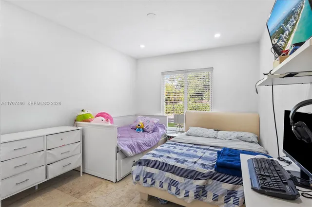 a bedroom with furniture and a fireplace