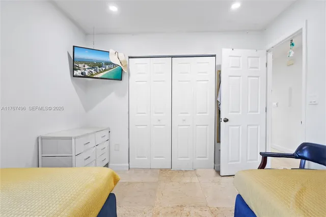 a bedroom with a bed and a table