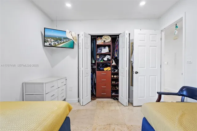 a bedroom with a bed and furniture