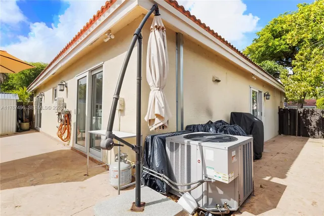 a view of outdoor kitchen with seating area
