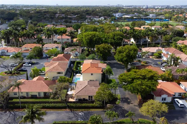 an aerial view of residential houses with outdoor space