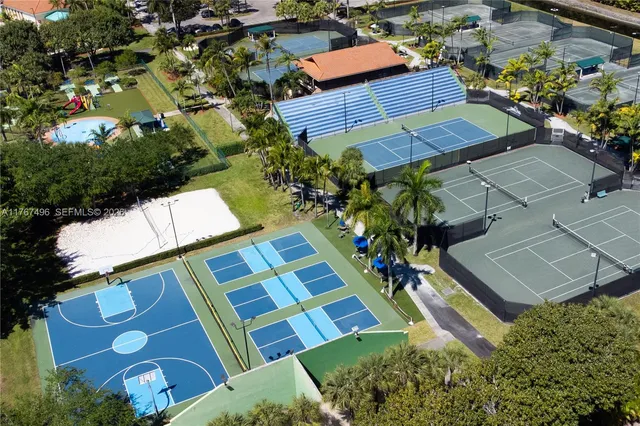 an aerial view of a house a yard and outdoor seating