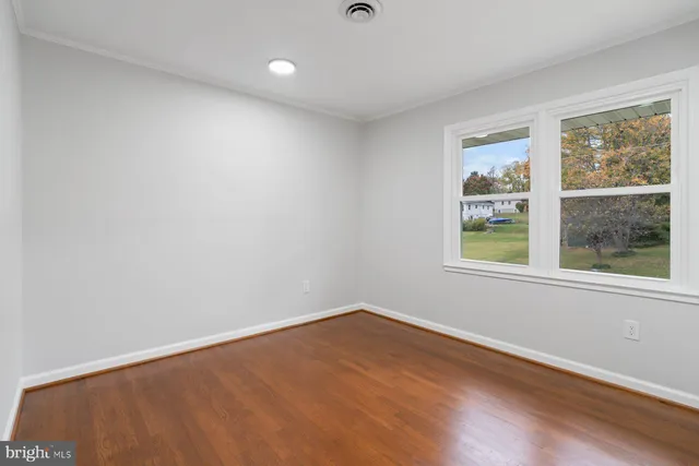 a balcony with wooden floor and fence