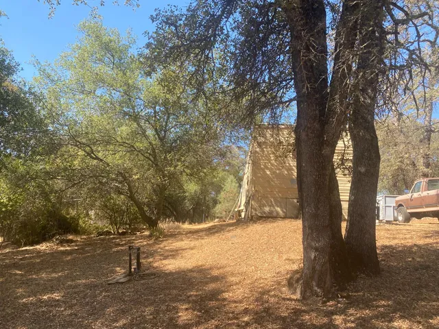 a backyard of a house with swimming pool