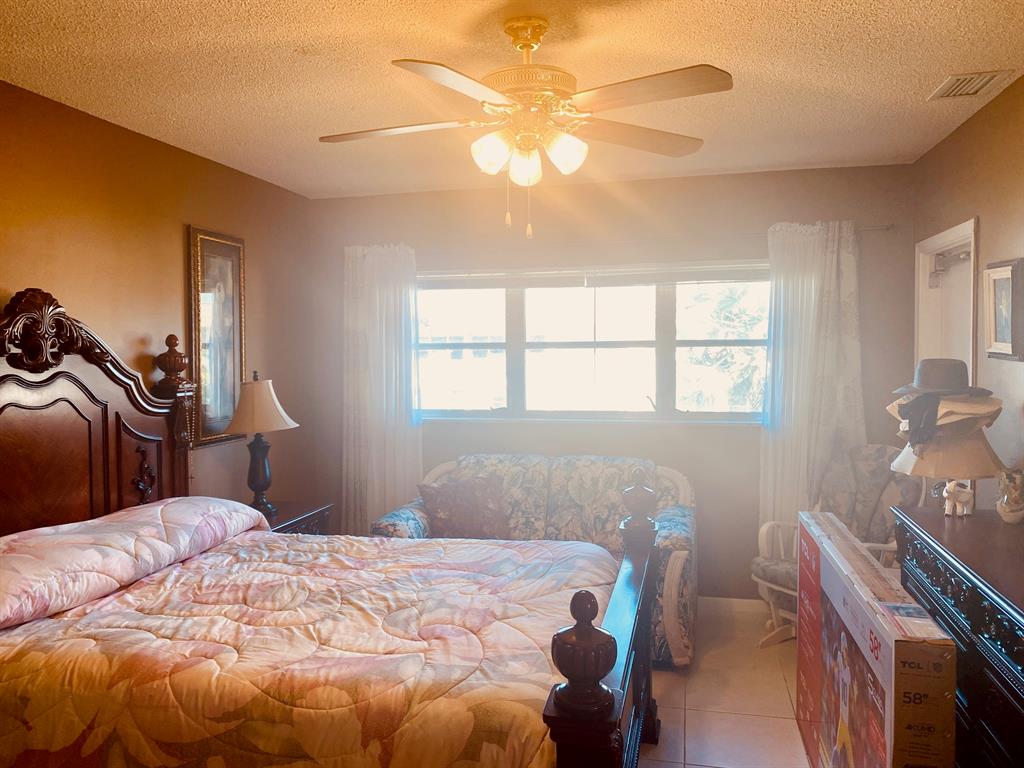 Northeast Boca Raton Boca Raton, FL 33431 - Photo 11 of 32 a bedroom with a bed and a window