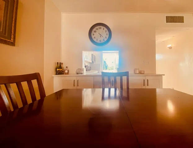 a view of dining room and wooden floor