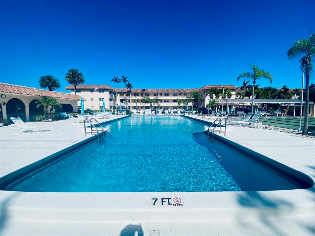 Northeast Boca Raton Boca Raton, FL 33431 - Photo 16 of 32 a view of a swimming pool with outdoor seating