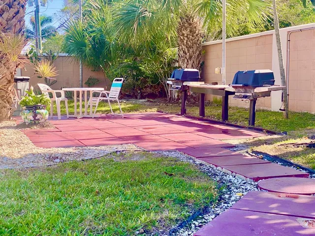 a patio with table and chairs