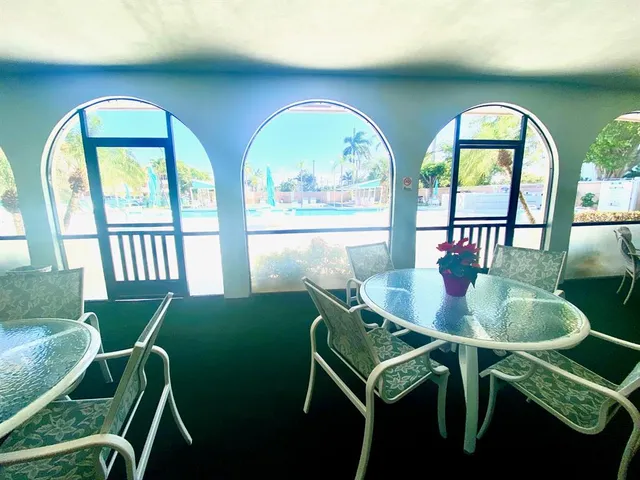 a view of a dining room with furniture window and outside view