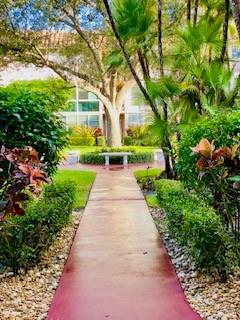 Northeast Boca Raton Boca Raton, FL 33431 - Photo 23 of 32 a view of a pathway with flower plants and wooden fence