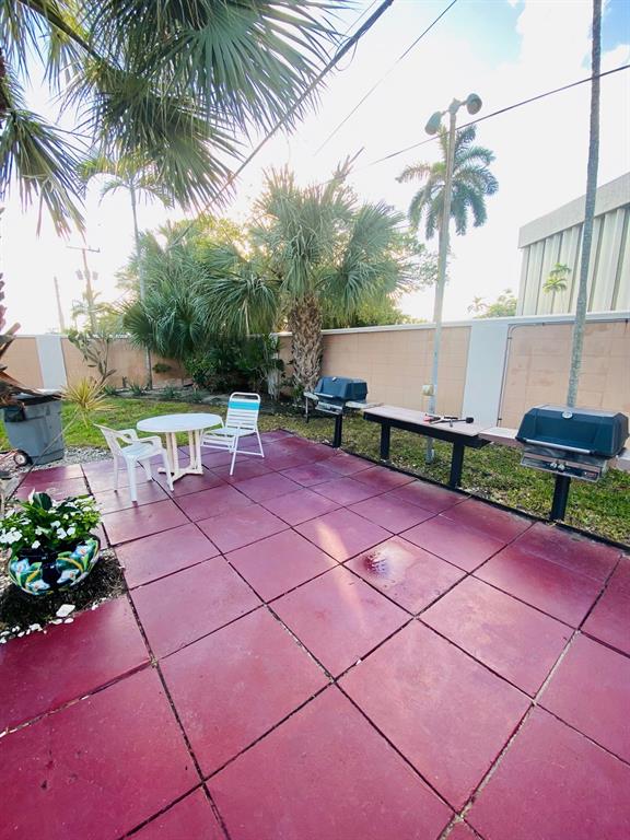 Northeast Boca Raton Boca Raton, FL 33431 - Photo 27 of 32 a white bench sitting in front of a building