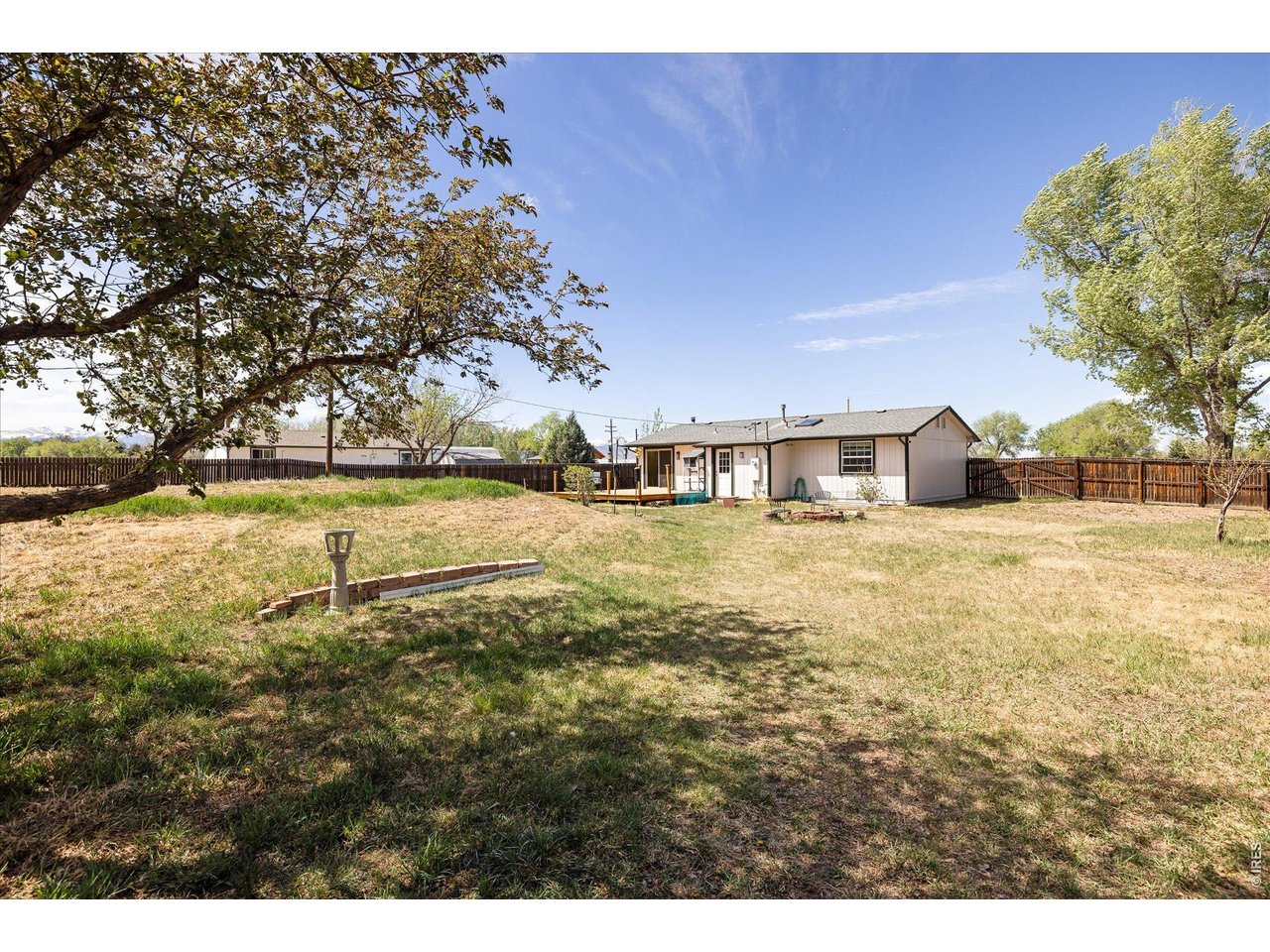9234 Arapahoe Road Boulder, CO 80303 - Photo 27 of 37 expansive backyard with mature trees, open lawn and room for gardening or recreation