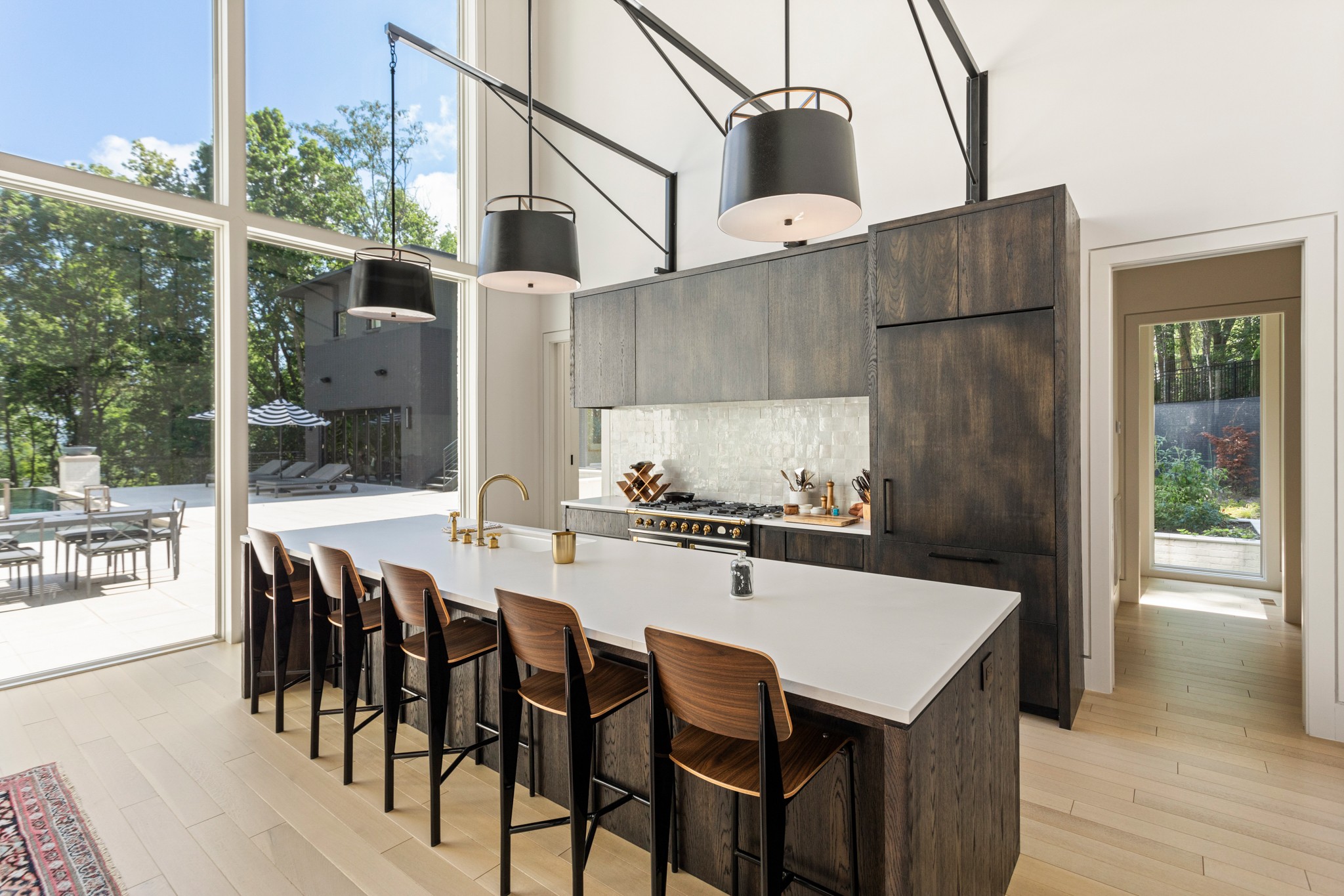 960 Overton Lea Road Nashville, TN 37220 - Photo 11 of 50 a kitchen with stainless steel appliances a table chairs and wooden floor