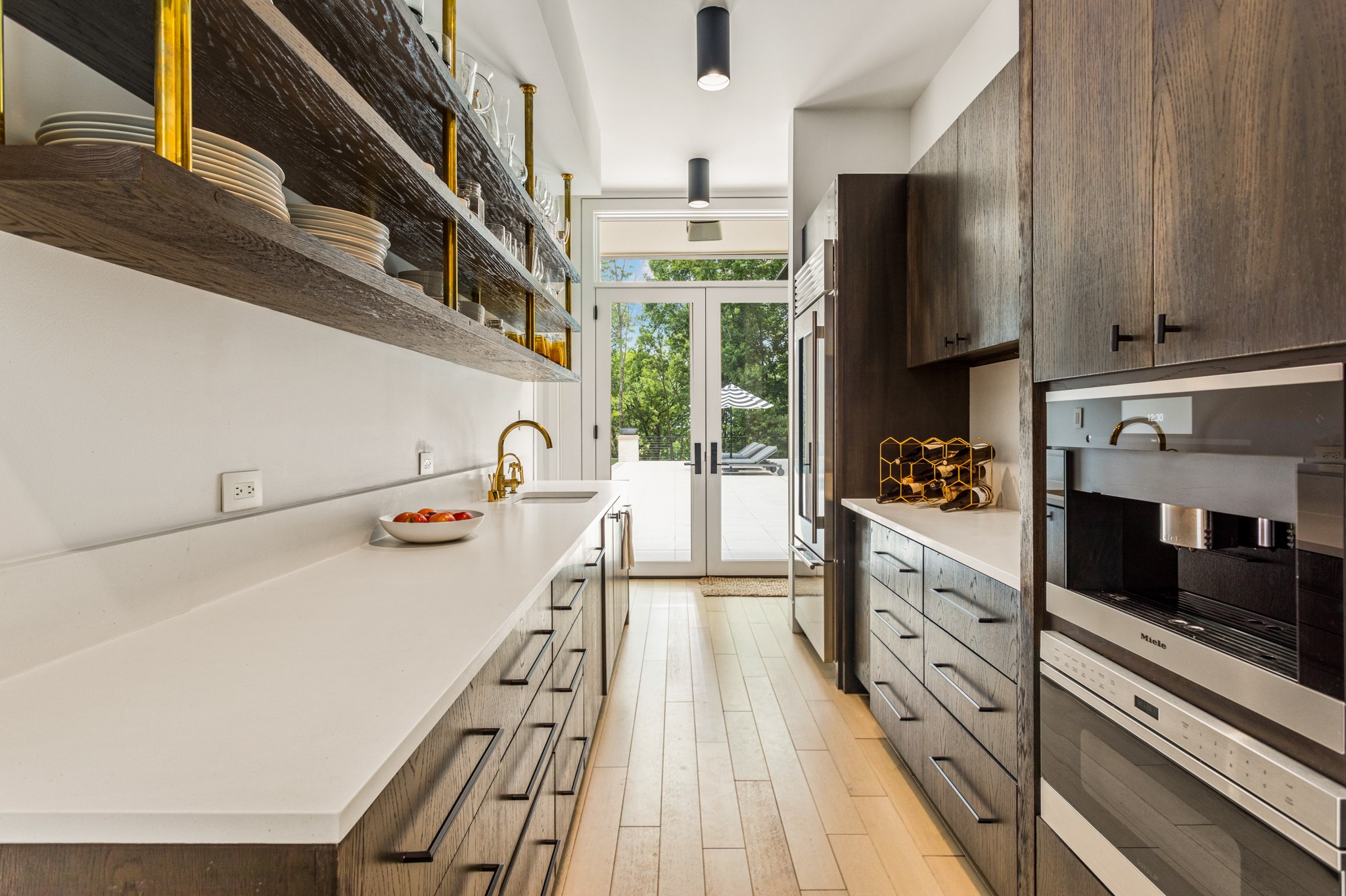 960 Overton Lea Road Nashville, TN 37220 - Photo 14 of 50 a kitchen with granite countertop a refrigerator a stove top oven a sink and dishwasher