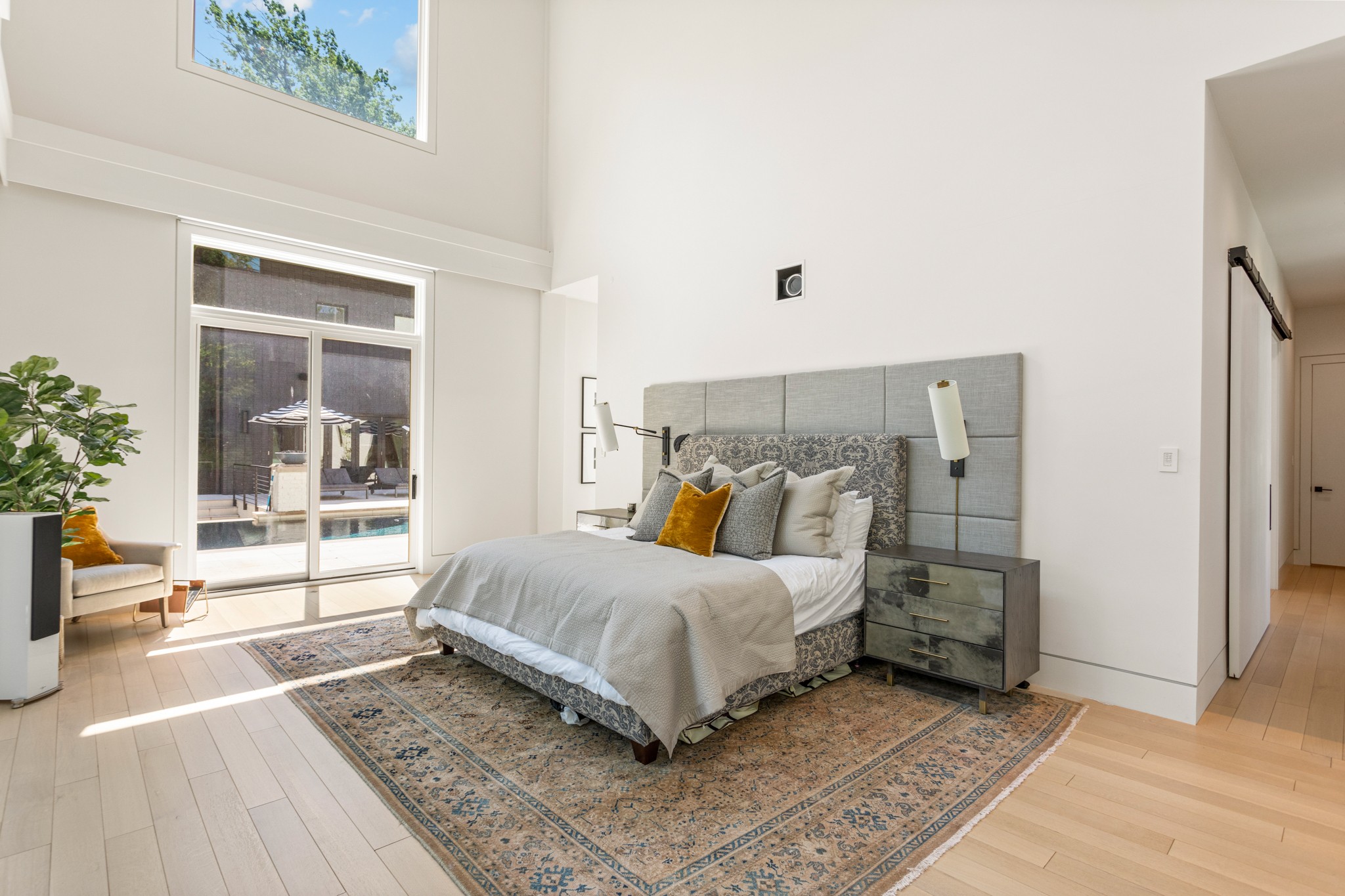 960 Overton Lea Road Nashville, TN 37220 - Photo 16 of 50 a bedroom with a large bed and a large window