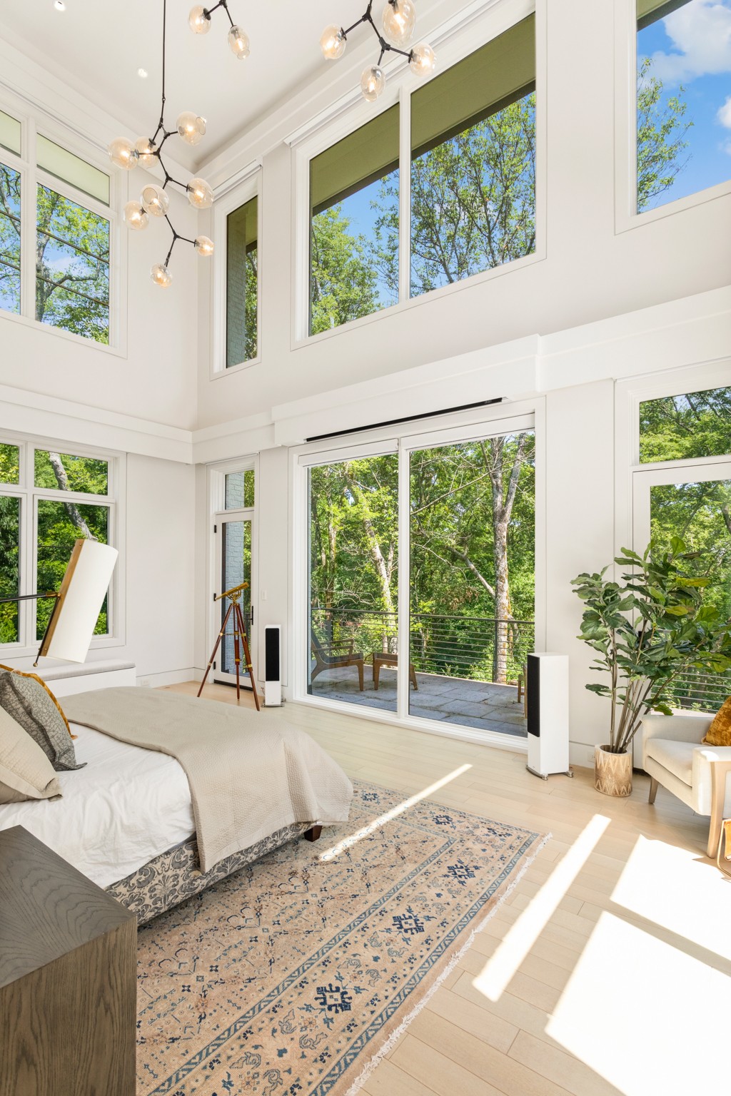 960 Overton Lea Road Nashville, TN 37220 - Photo 17 of 50 a large bedroom with a large bed and a large window