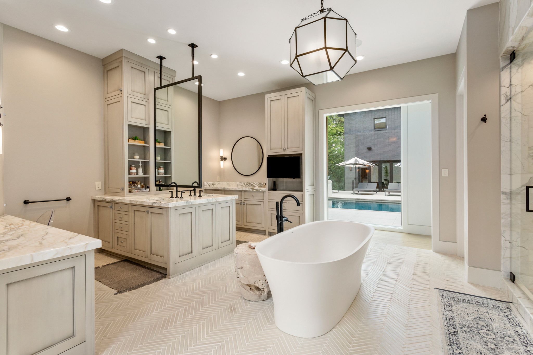 960 Overton Lea Road Nashville, TN 37220 - Photo 20 of 50 a bathroom with a double vanity sink a mirror a bathtub and shower