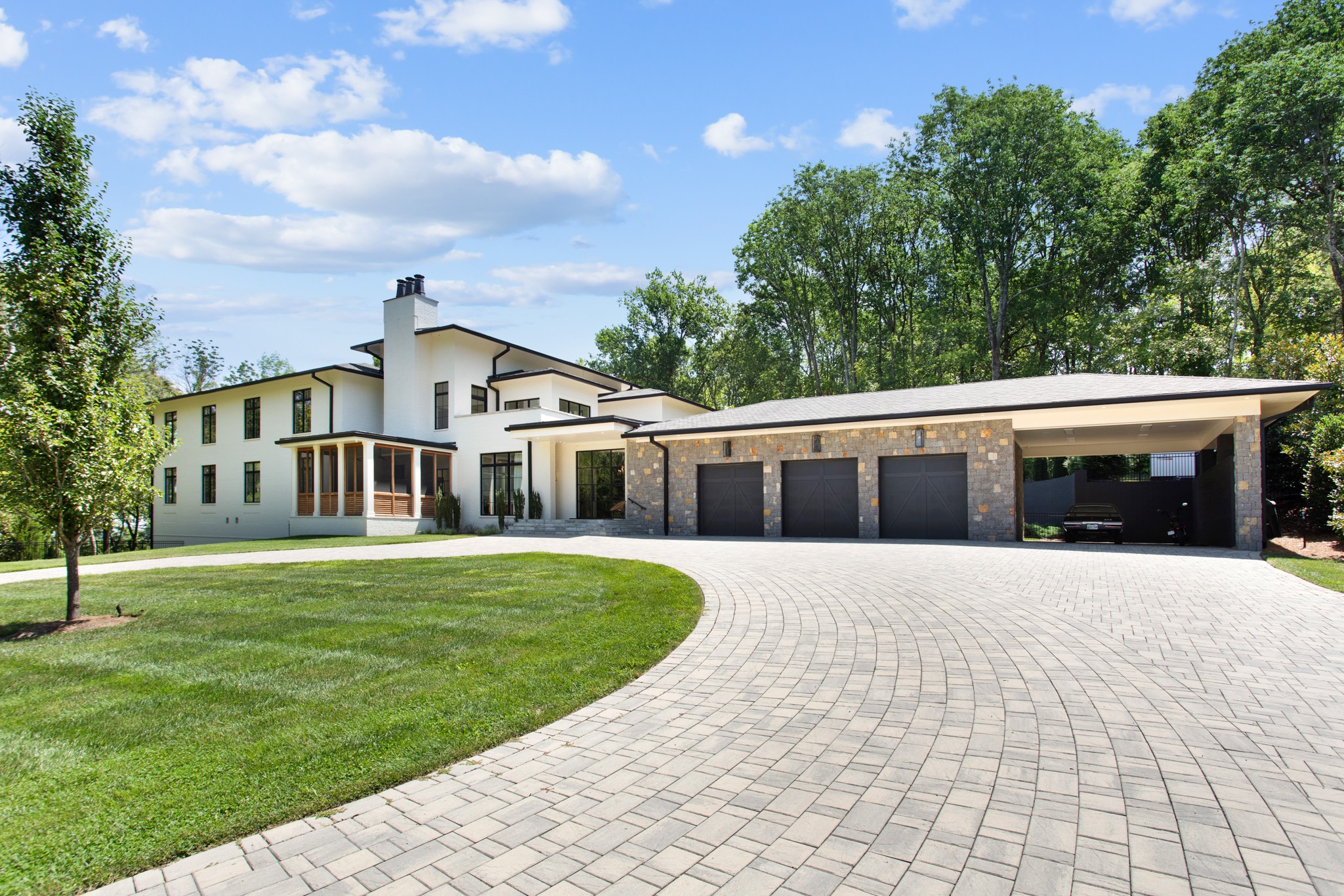 960 Overton Lea Road Nashville, TN 37220 - Photo 2 of 50 a front view of a house with a yard