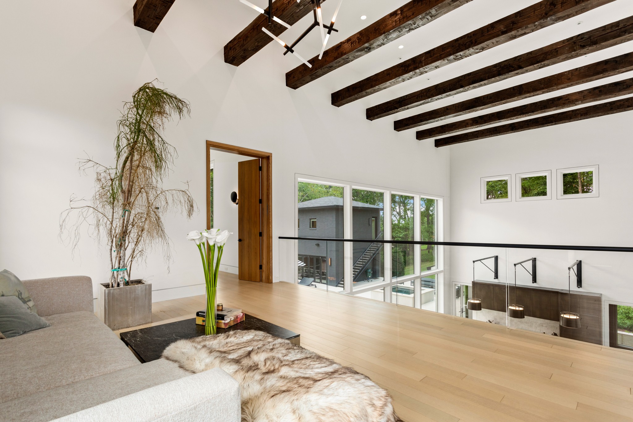 960 Overton Lea Road Nashville, TN 37220 - Photo 24 of 50 a bedroom with a bed and wooden floor