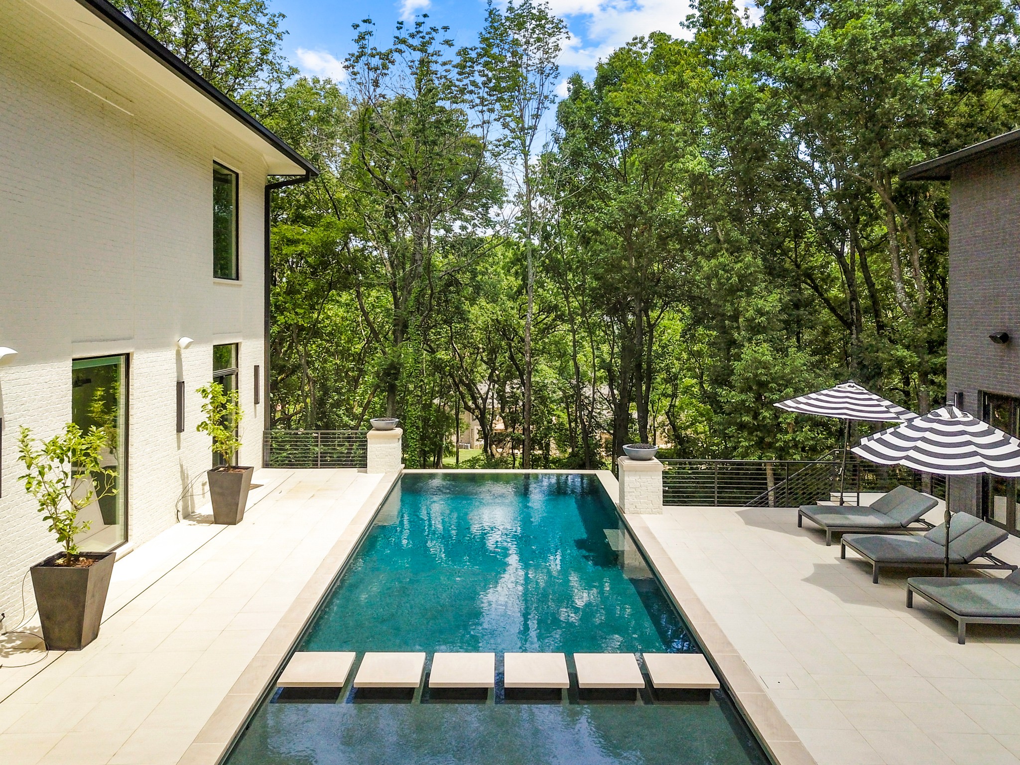 960 Overton Lea Road Nashville, TN 37220 - Photo 38 of 50 a view of swimming pool with outdoor seating and plants