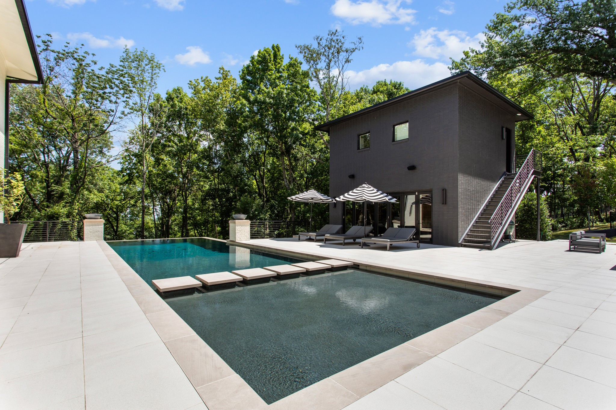 960 Overton Lea Road Nashville, TN 37220 - Photo 39 of 50 a view of a swimming pool with a patio