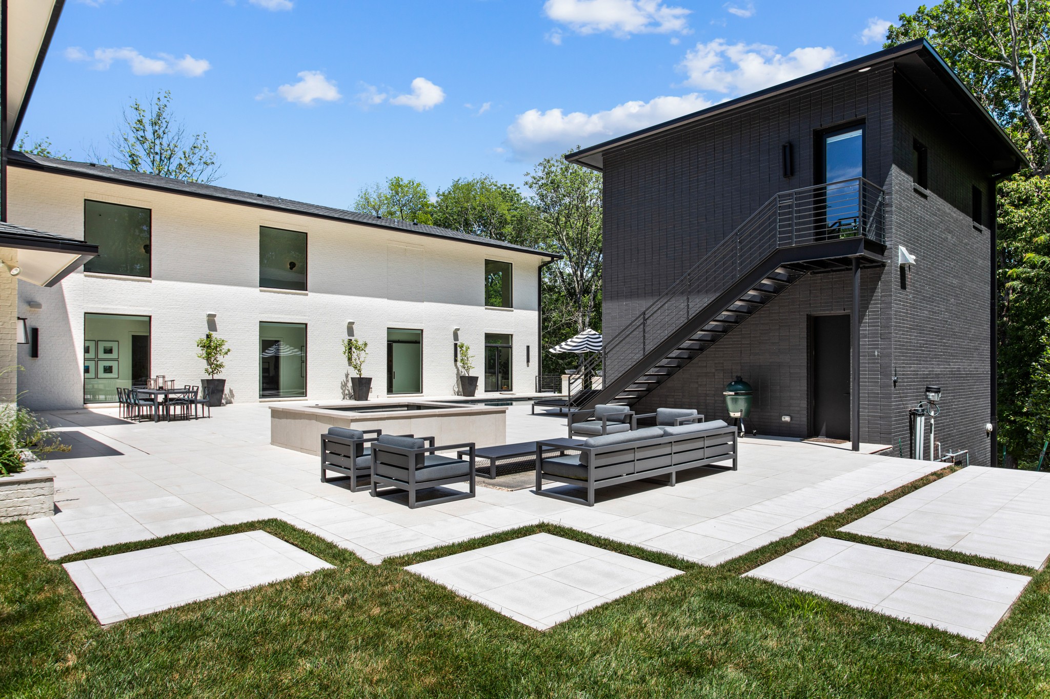 960 Overton Lea Road Nashville, TN 37220 - Photo 40 of 50 a view of an house with backyard porch and kitchen