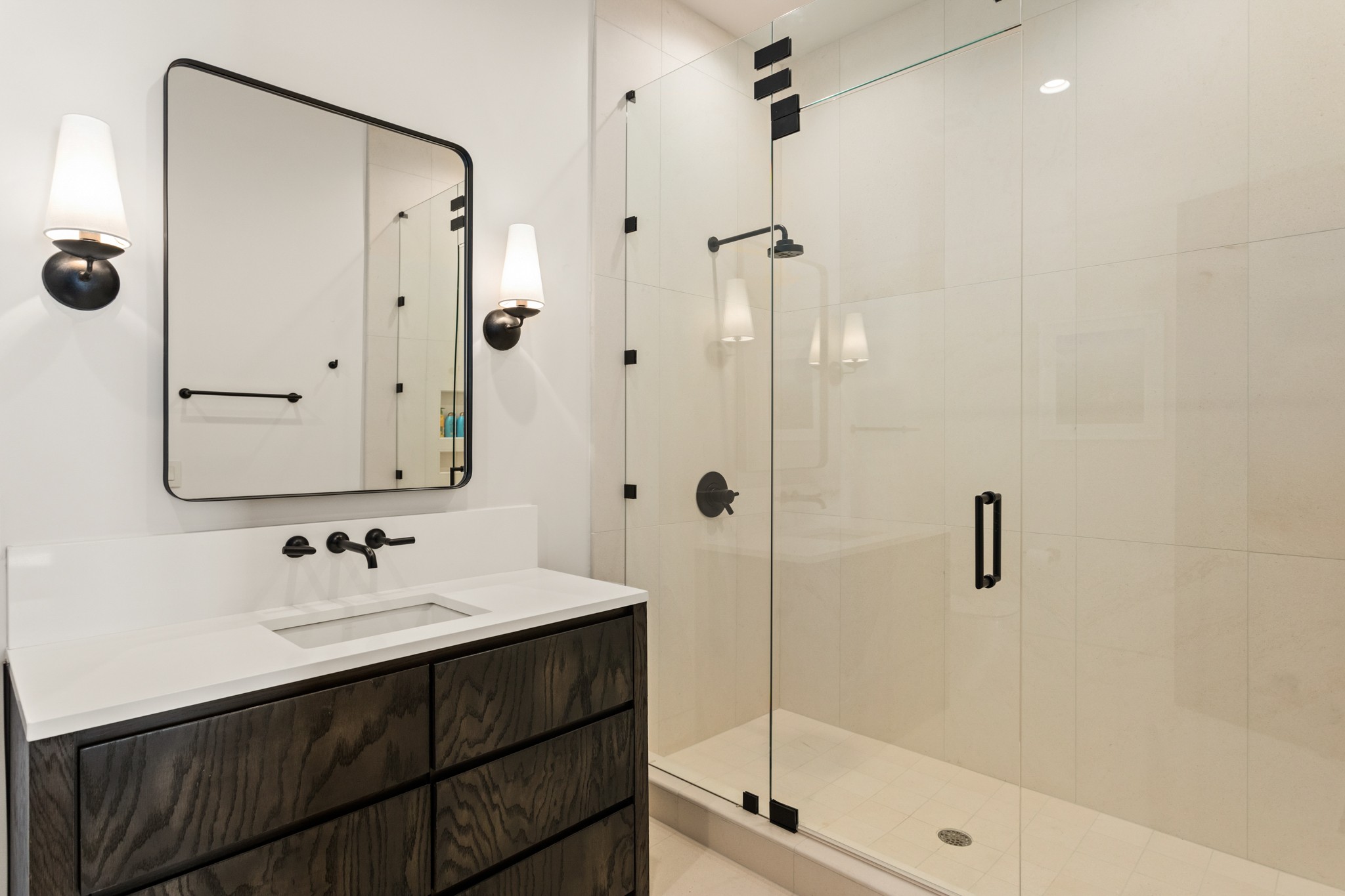 960 Overton Lea Road Nashville, TN 37220 - Photo 45 of 50 a bathroom with a shower sink and mirror