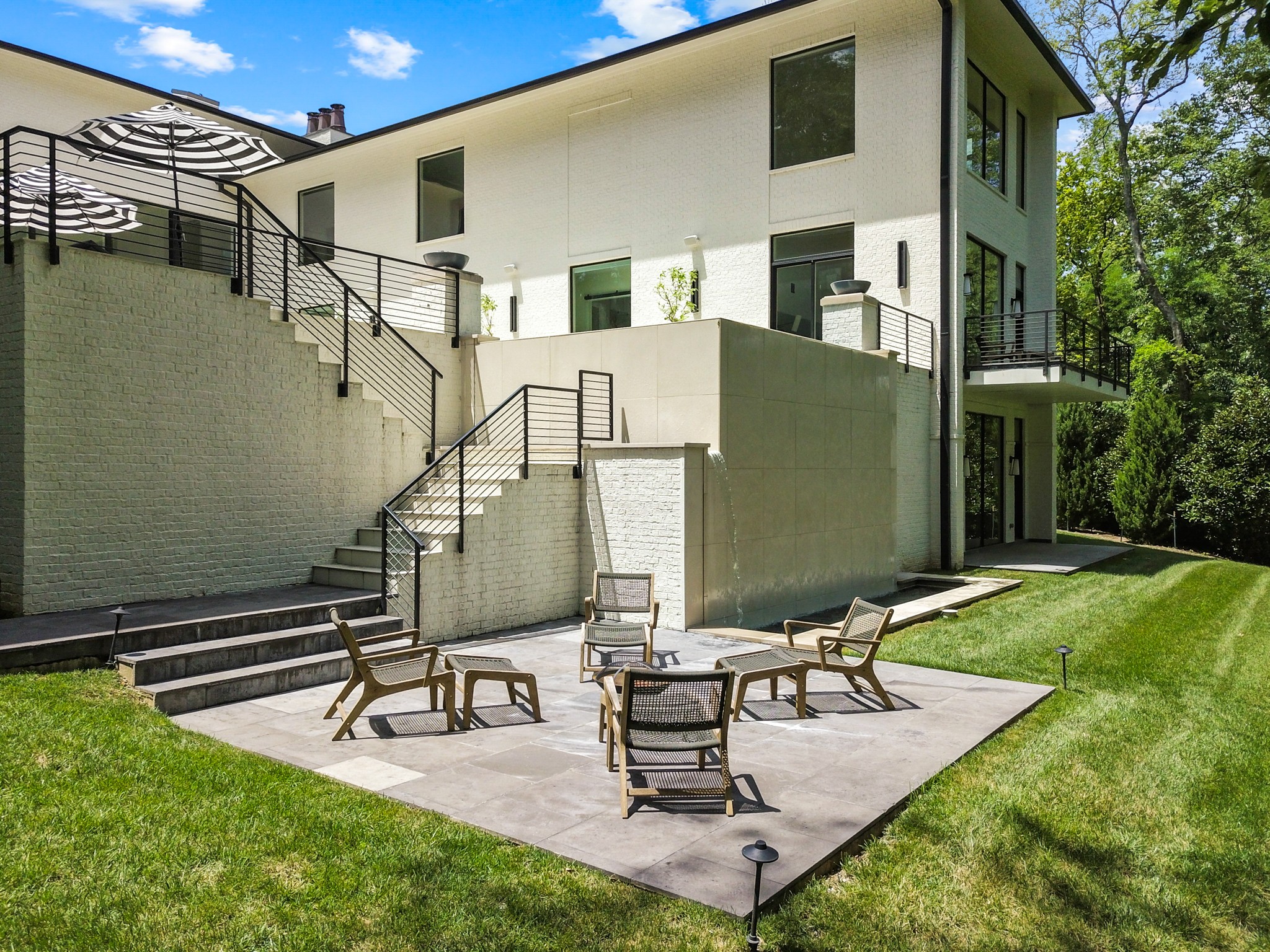 960 Overton Lea Road Nashville, TN 37220 - Photo 48 of 50 a view of a house with backyard and sitting area