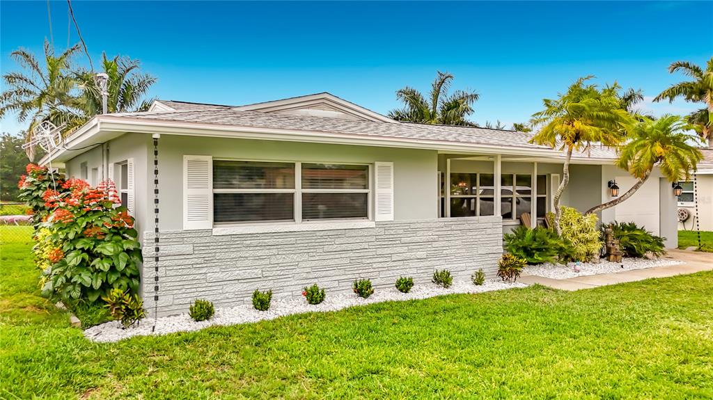 508 Shore Drive Largo, FL 33771 - Photo 3 of 31 a front view of a house with garden