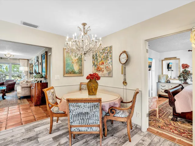 a kitchen that has a lot of cabinets a sink and a stove in it