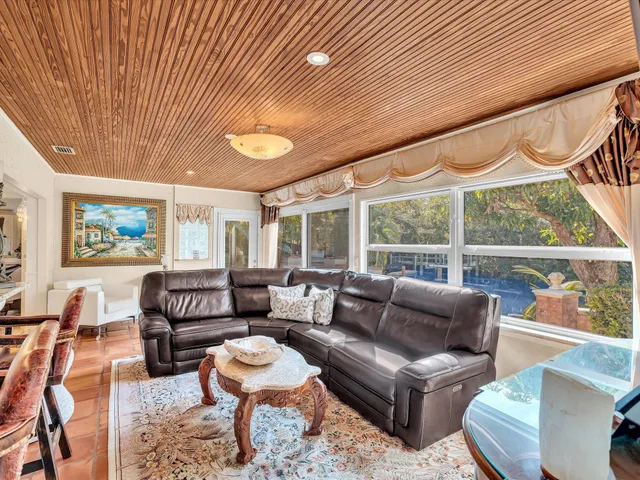 a view of a lake with chairs