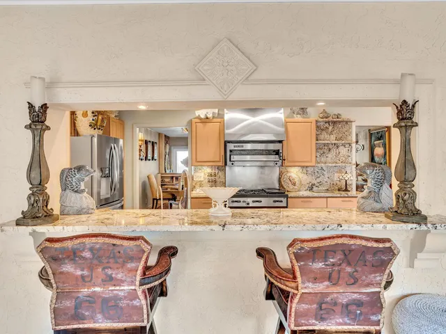 a spacious bathroom with a double vanity sink a large mirror and a bathtub