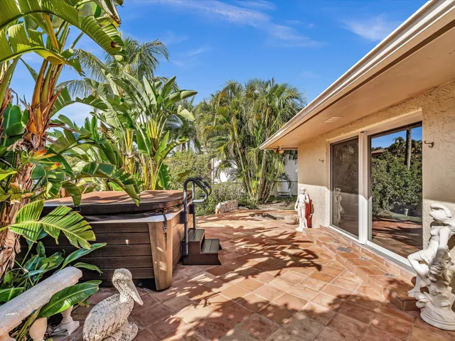 a en suite bathroom with a granite countertop sink and a mirror