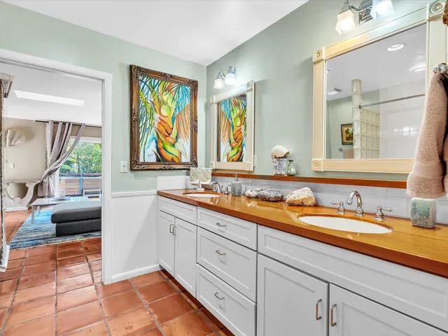 an aerial view of a house with a garden and a yard