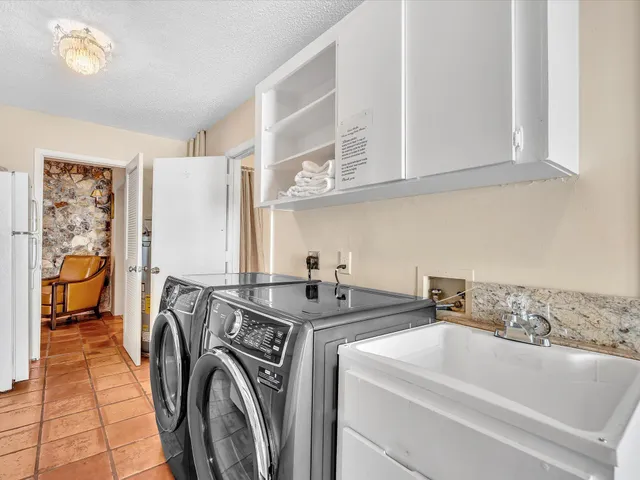 an aerial view of residential building and lake