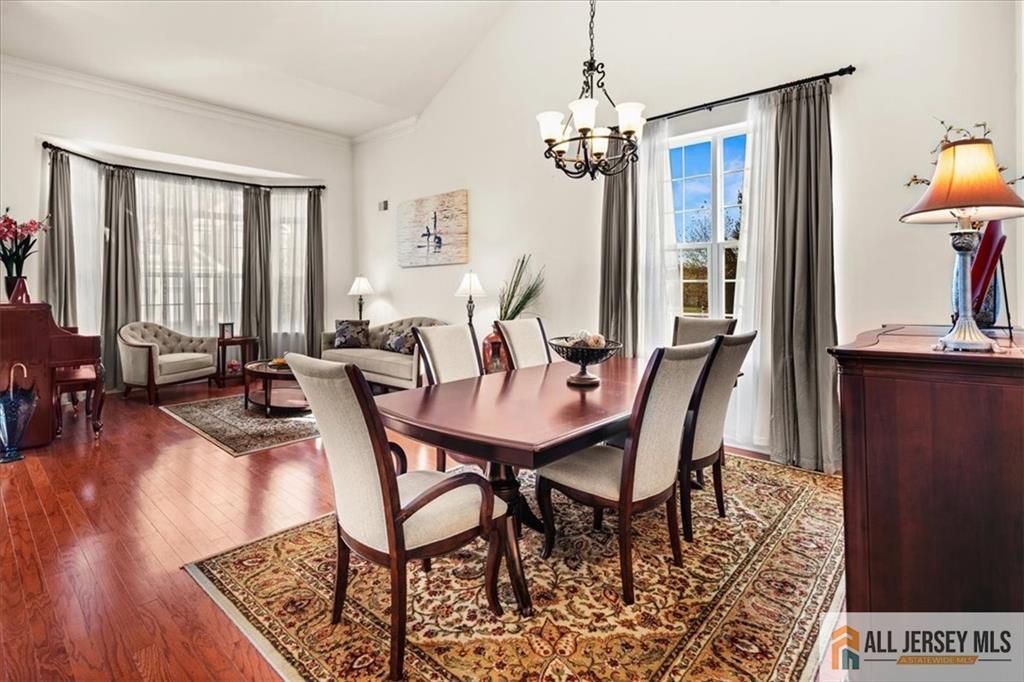 9 Bellingham Drive Kendall Park, NJ 08824 - Photo 11 of 65 a view of a dining room with furniture window and wooden floor