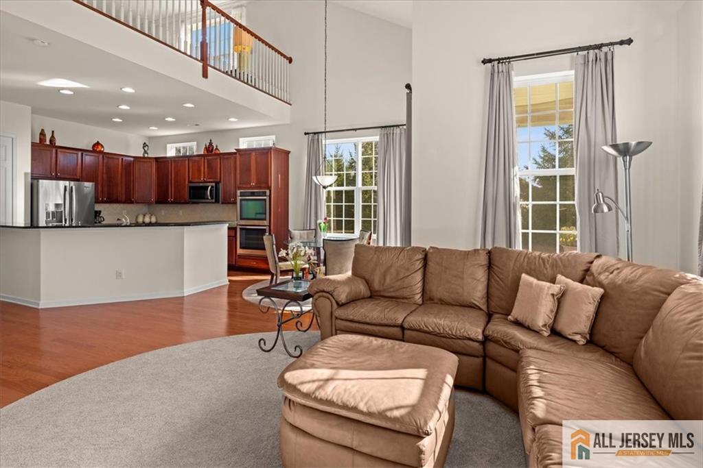 9 Bellingham Drive Kendall Park, NJ 08824 - Photo 17 of 65 a living room with furniture and a window