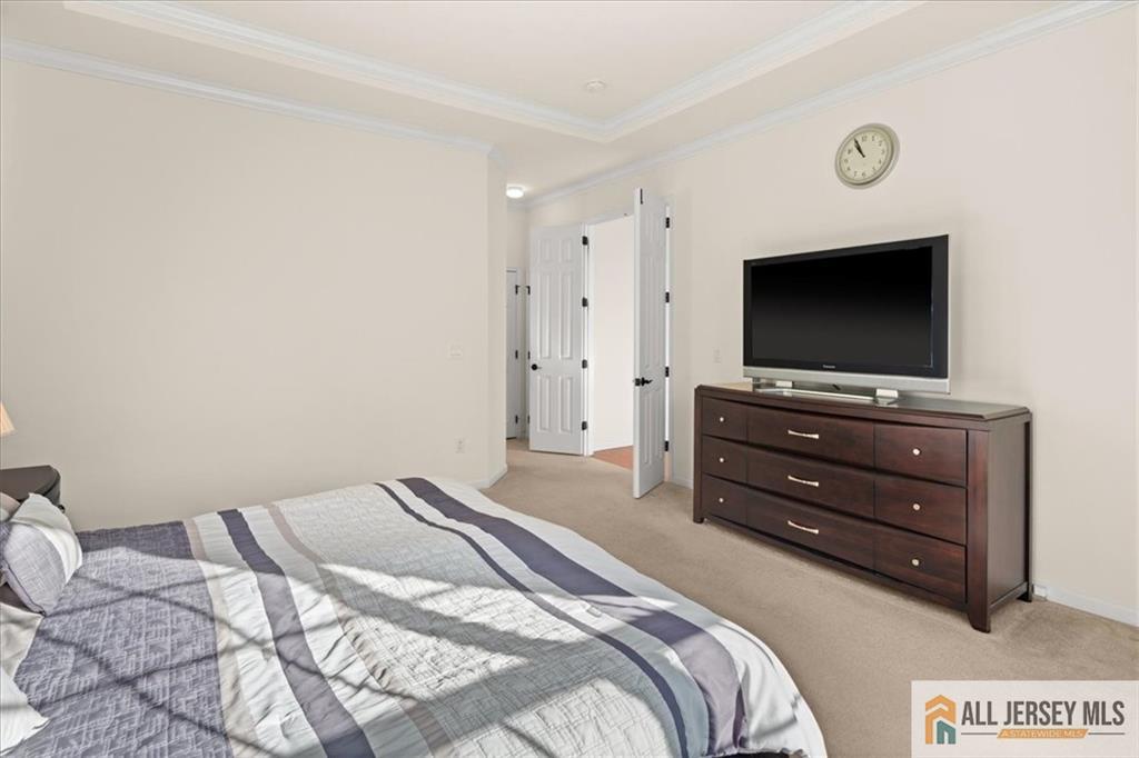 9 Bellingham Drive Kendall Park, NJ 08824 - Photo 25 of 65 a bedroom with a bed and a flat screen tv